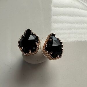 Kendra Scott black stud earrings.